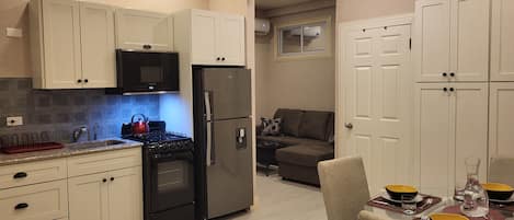 Fridge, microwave, toaster, dining tables