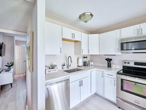 Fridge, microwave, oven, stovetop - Elegant 2BR Haven by the Water (Riviera Beach)