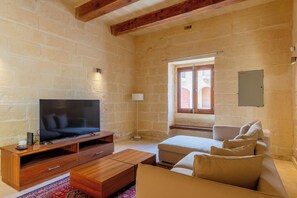 Family House, Multiple Bedrooms (OneFifty Gozitan Villa and Pool) | Living area | 21-inch flat-screen TV with satellite channels, fireplace - Onefifty Gozitan Villa and Pool (Xaghra)