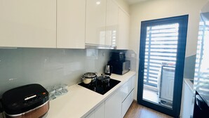 Family Apartment | Private kitchen | Fridge, cookware/dishes/utensils - TITRI House Vinhomes Skylake Apartment (Hanoi)
