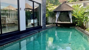Basic Room, 3 Bedrooms, City View | Living area | 64-inch LED TV with cable channels - Baliem Villa (Jimbaran)