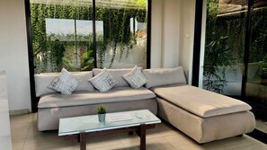 Basic Room, 3 Bedrooms, City View | Living area | 64-inch LED TV with cable channels - Baliem Villa (Jimbaran)