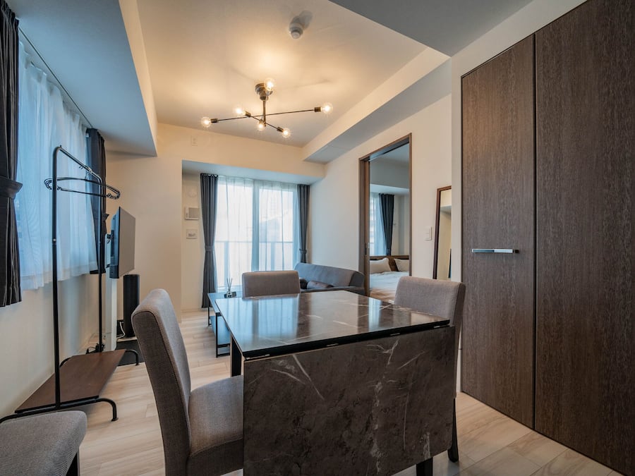 Business Apartment | Living area | Flat-screen TV