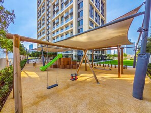 Children's play area - outdoor - Cityscape Splendor Lavish 1BR Uptown  (Dubai)