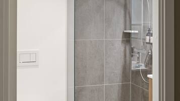 Shower, eco-friendly toiletries, hair dryer, towels