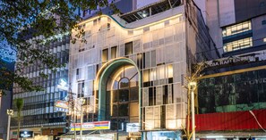 A modern building with large windows and a prominent archway. - Bobopod Thamrin, Jakarta (Jakarta)