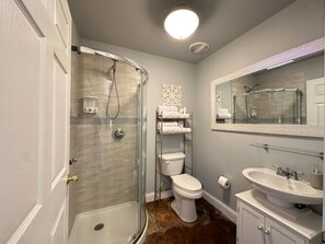 Shower, hair dryer, towels, soap