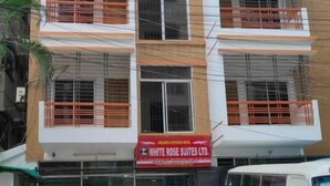 A multi-story building with balconies and a sign for White Rose Suites Ltd. - White Rose Suites Ltd (Dhaka)