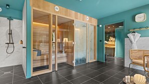A modern bathroom with a glass shower enclosure, a wooden vanity, and a towel rack. - Hôtel Le Rituel Honfleur (Honfleur)