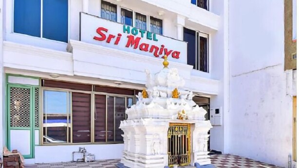 A hotel named "Sri Maniya" with a white facade and a decorative white structure in front. - HOTEL SRIMANIYA (Nagercoil)