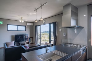 Exclusive Villa, 3 Bedrooms, Kitchen, Garden View | Living area | 50-inch LCD TV with digital channels, Netflix, streaming services - Private House u-zi house (Yaese)
