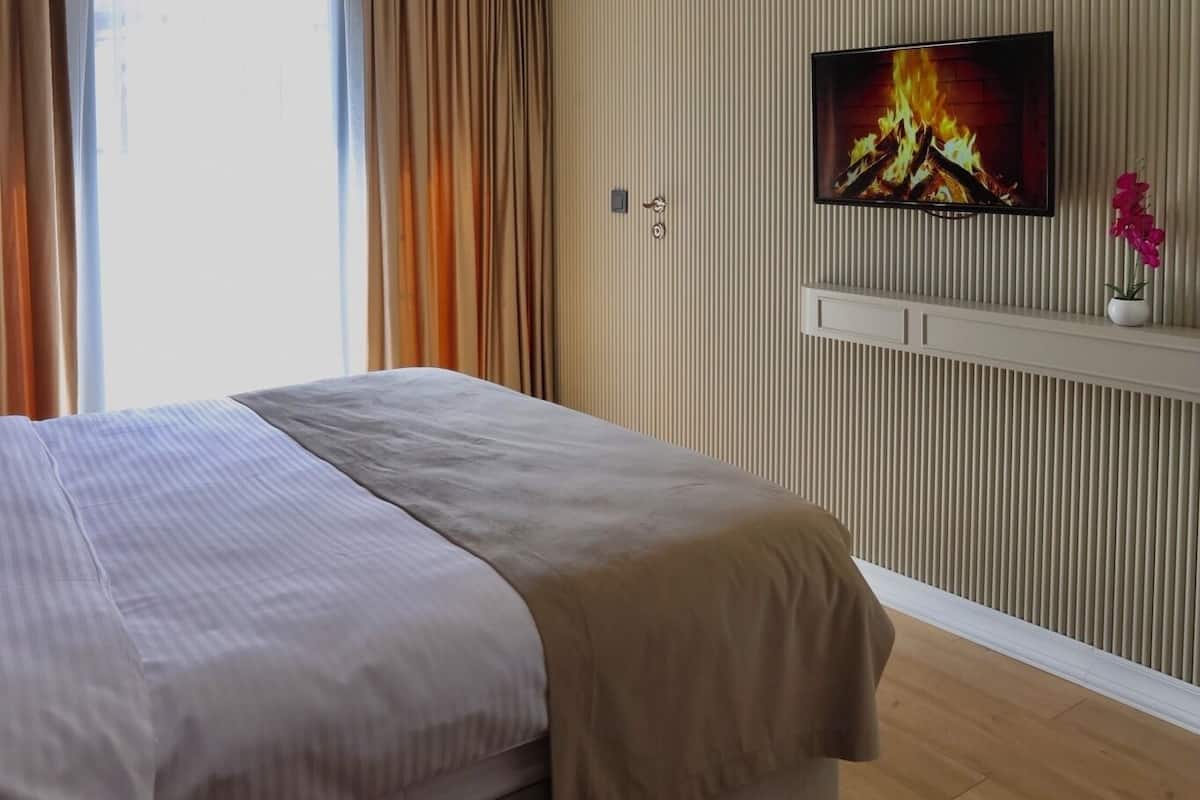 Premium bedding, down duvets, memory-foam beds, in-room safe