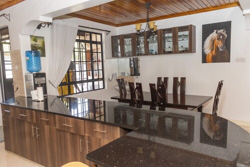 Elevate by African Manor