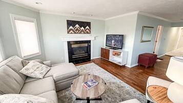 TV, fireplace, books, offices