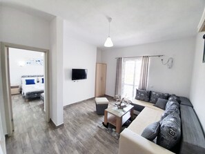 Basic Apartment, Multiple Beds, Non Smoking, Kitchen | Living area | 32-inch LED TV with cable channels