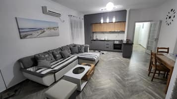 Basic Apartment, Multiple Beds, Non Smoking, Kitchen | Living area | 32-inch LED TV with cable channels