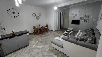 Basic Apartment, Multiple Beds, Non Smoking, Kitchen | Living area | 32-inch LED TV with cable channels
