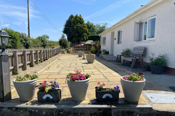 exterior patio with plant pots around the edges