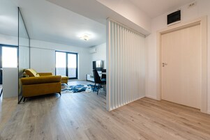 Premium Apartment | Living area | 55-cm Smart TV with cable channels, Netflix, streaming services