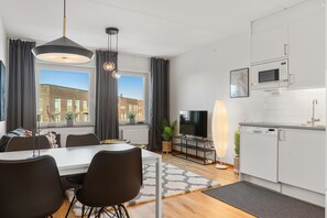 Deluxe Apartment | Living area | 40-inch Smart TV with digital channels