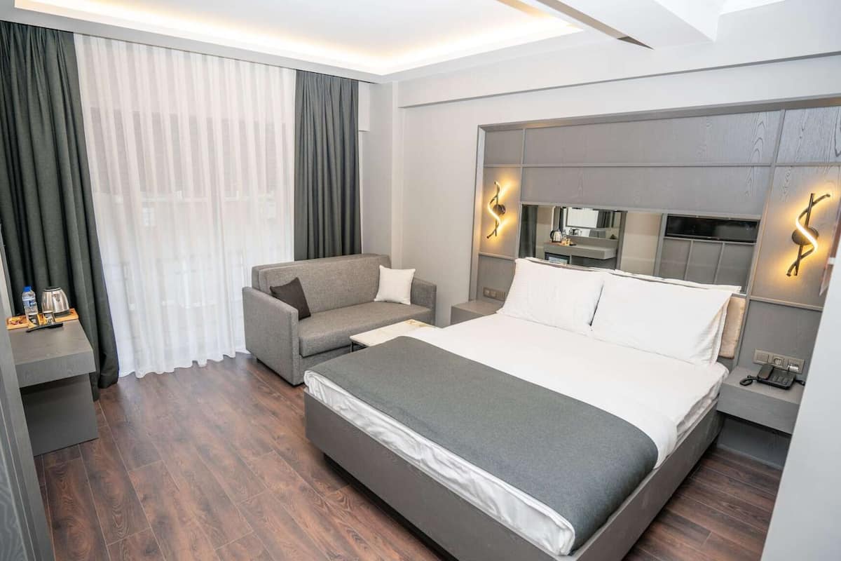Premium bedding, desk, laptop workspace, soundproofing