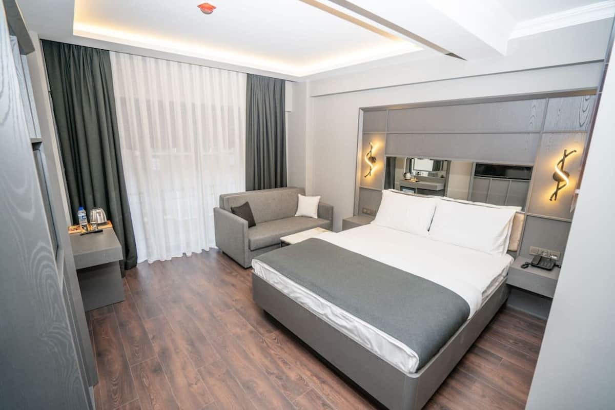 Premium bedding, desk, laptop workspace, soundproofing