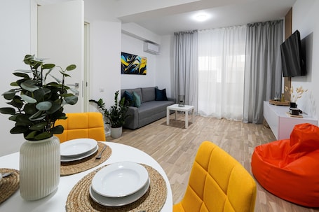 Premium Apartment | Living area | 55-cm Smart TV with cable channels, Netflix, streaming services