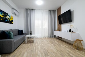 Premium Apartment | Living area | 55-cm Smart TV with cable channels, Netflix, streaming services