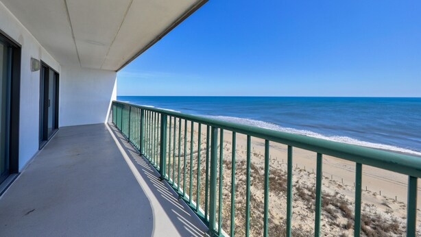 A balcony with a view of the beach and ocean. - Summer Beach 801 by Seaside Vacations & Sales (Ocean City)