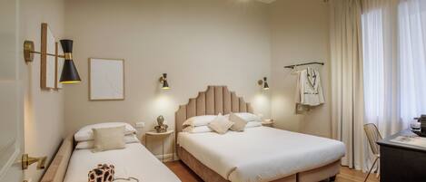 Comfort Triple Room | Minibar, desk, laptop workspace, iron/ironing board