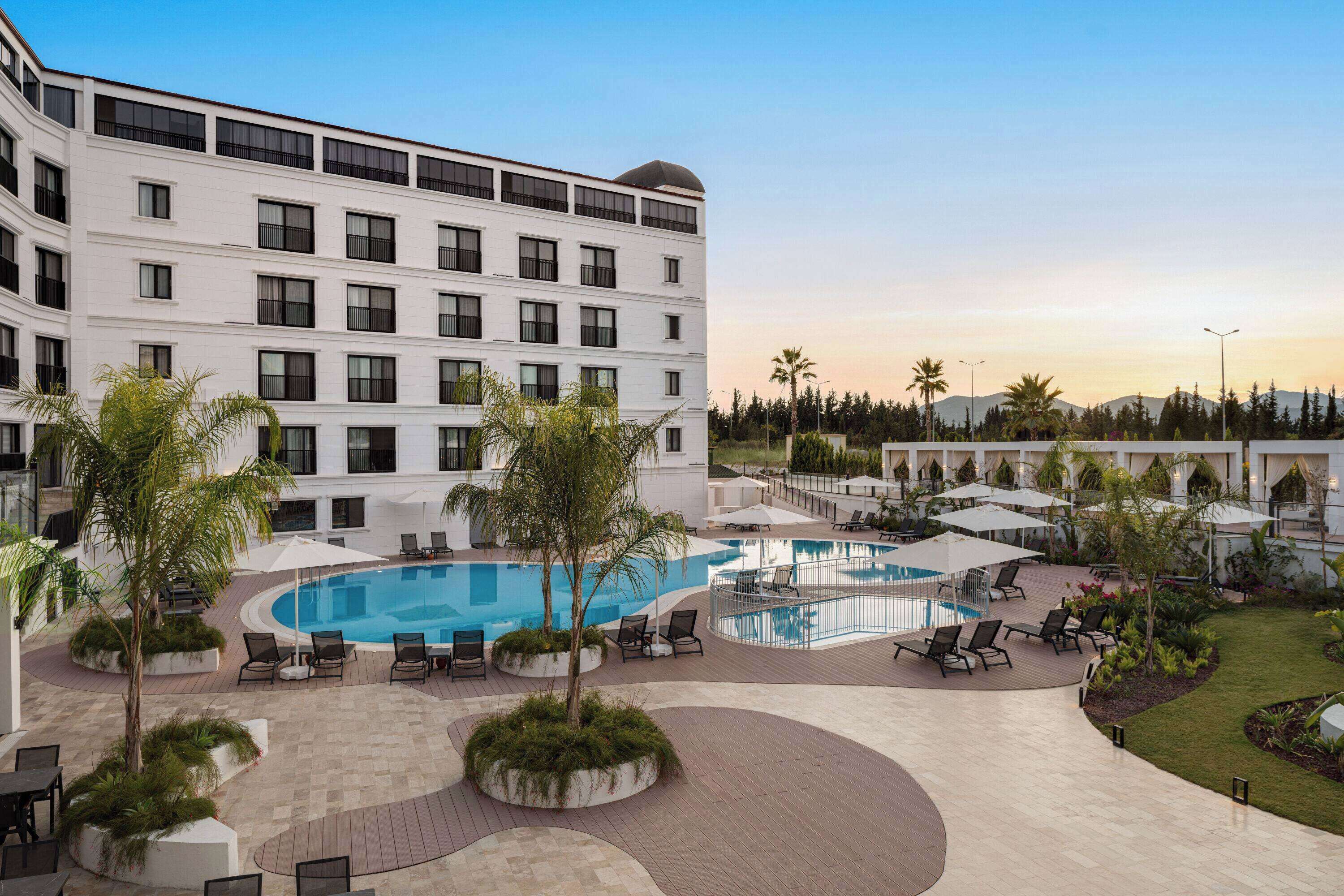 Outdoor pool, open 10:00 AM to 7:00 PM, free pool cabanas