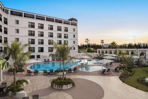 Outdoor pool, open 10:00 AM to 7:00 PM, free pool cabanas