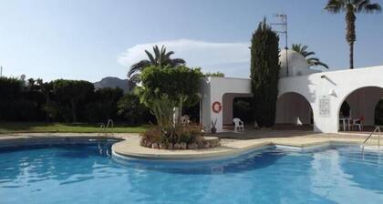 A beautiful 2-bedroom south-facing townhouse five-minutes walk from the beach