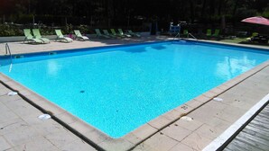 A rectangular swimming pool with a clear blue water surface, surrounded by a tiled deck. - "koantig" Maison/site Exceptionnel, Tregastel,perros Guirec, Trébeurden,calme, (Pleumeur bodou)