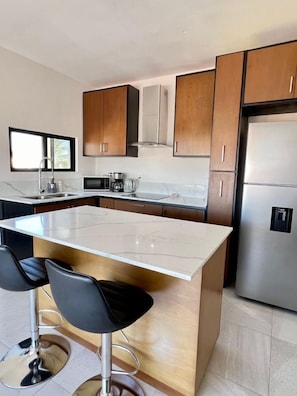 Fridge, microwave, stovetop, coffee/tea maker