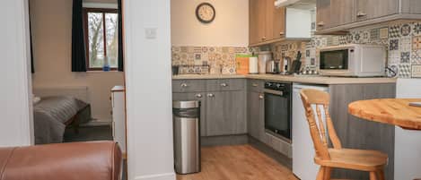 Fridge, electric kettle, toaster, cookware/dishes/utensils