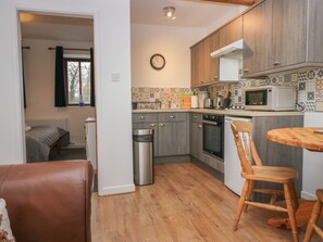 Fridge, electric kettle, toaster, cookware/dishes/utensils