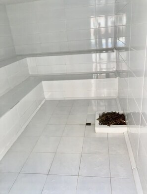 Bathroom features a white sink and a small tray with toiletries.