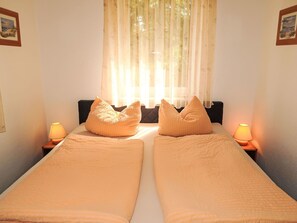 1 bedroom, travel crib, bed sheets