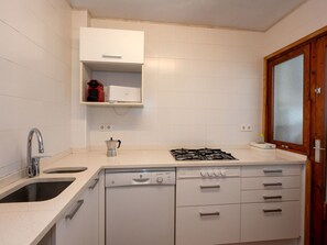 Oven, dishwasher, toaster, dining tables