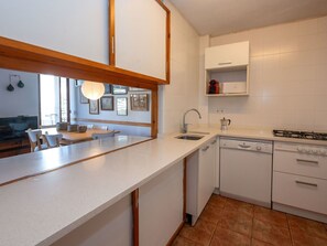 Oven, dishwasher, toaster, dining tables