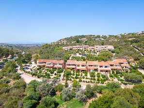 Stunning hillside homes nestled among lush greenery.