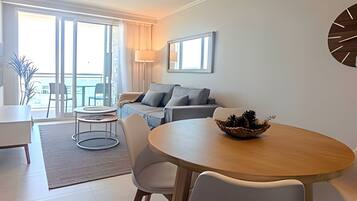 Apartment | Living area | 50-inch Smart TV with satellite channels