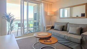 Apartment | Living area | 50-inch Smart TV with satellite channels