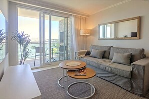 Family Apartment | Living room | 50-inch Smart TV with satellite channels