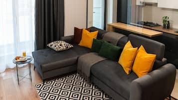 Superior Apartment, Balcony | Living area | 60-cm Smart TV with cable channels, Netflix, streaming services
