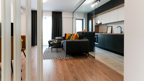 A modern apartment with a living area, kitchen, and dining space. - Sandra (Bucharest)
