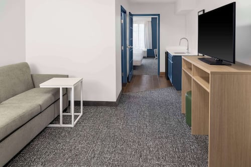 Suite, 1 Bedroom | Living area | TV