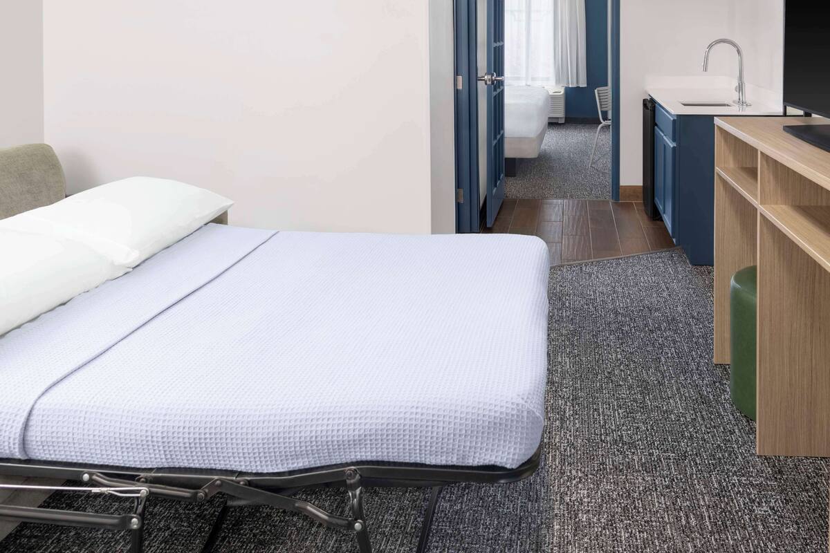 Suite, 1 Bedroom | Living area | 50-inch TV with cable channels