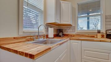 Fridge, oven, coffee/tea maker, cookware/dishes/utensils